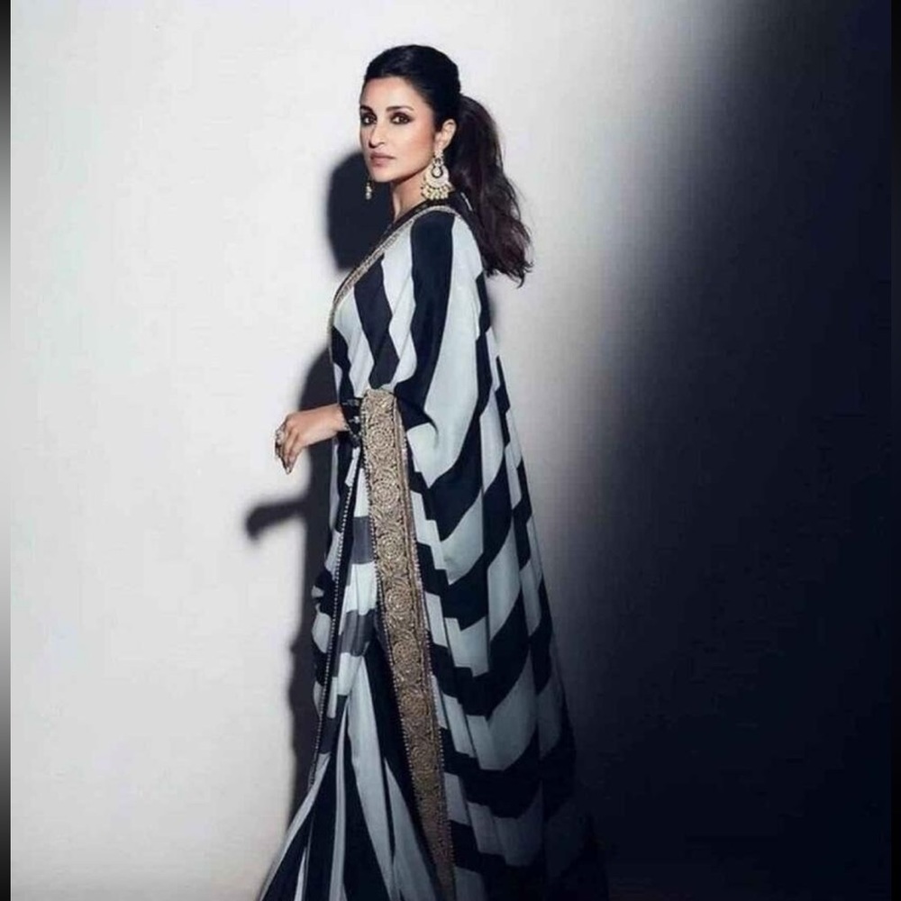 Black and white stripe saree with readymade full sleeve blouse.